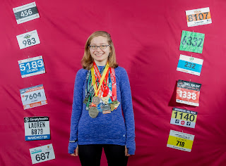 me with medals and bibs