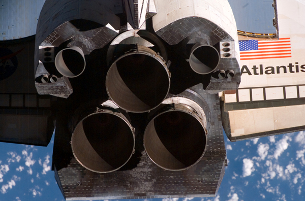 A rear view of the orbiter Atlantis...with her three Space Shuttle Main Engines and two OMS thrusters visible.