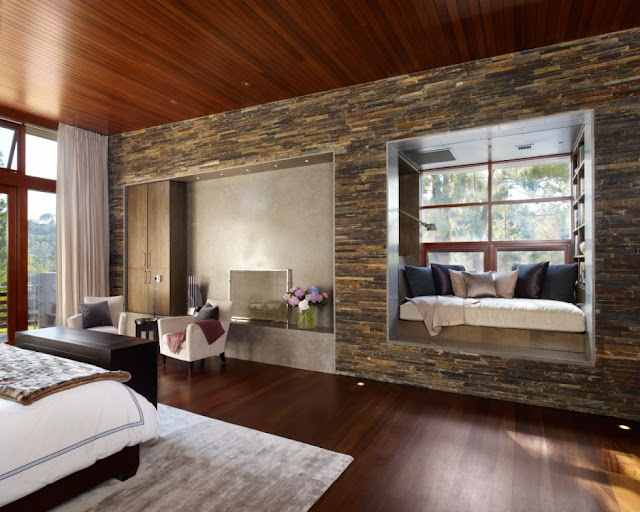 Bedroom with stone wall 