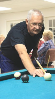 Photo of Palmer playing pool