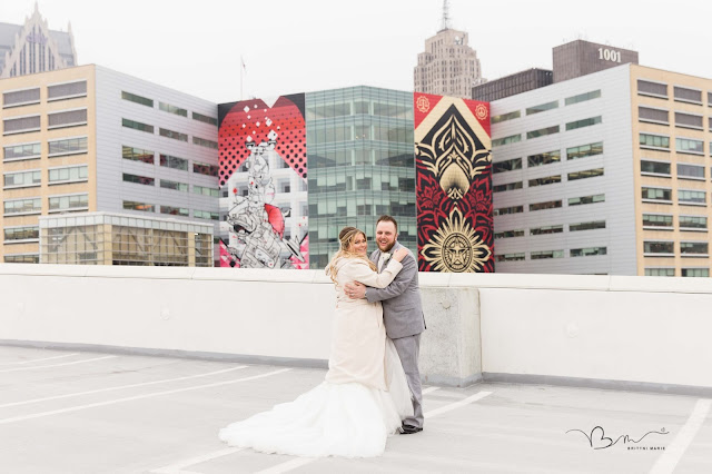 bride and groom overlooking Detroit city skyline on z belt lot 