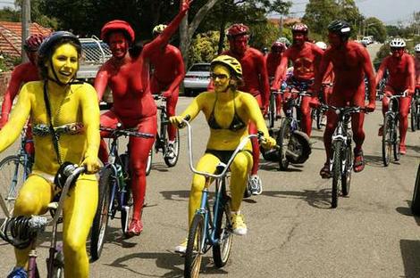 full-body paint girl riding a bike again