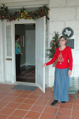 A docent welcomes guests inside a historic Fredericksburg home during last year's Holiday Home Tour. This year's Preservation Weekend on Dec 12 and 13 features eight unique properties, as well as the Tannenbaum Ball.