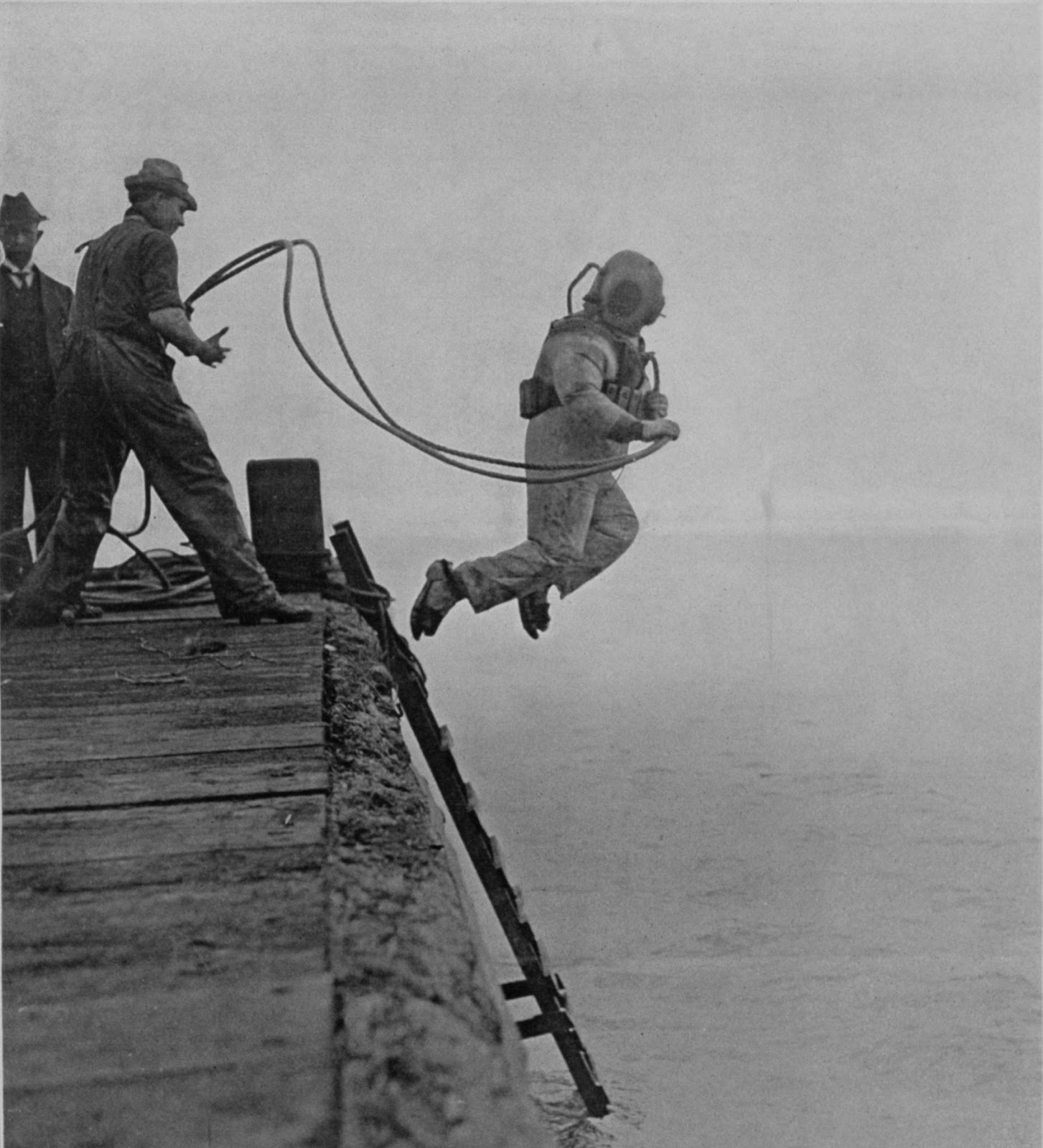 36 Amazing Historical Pictures. #9 Is Unbelievable - A deep sea diver is captured mid-jump. The cover of Scientific American Supplement on October 23, 1915