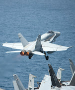 F/A18 Fighter jets of the Carrier Air Wing 7 Aboard CVN 69 (fa cd ef carrier air wing aircraft operate off the flight deck of the aircraft carrier uss dwight)
