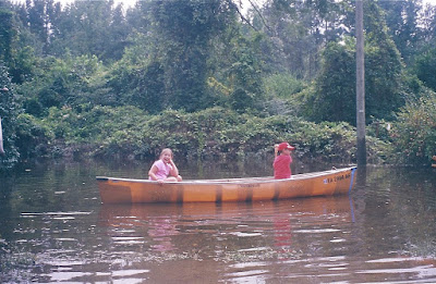 Zack & Sarah canoe in Gaston's flood water in our yard