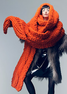 photograph of a knitted orange scarf by Giles Deacon