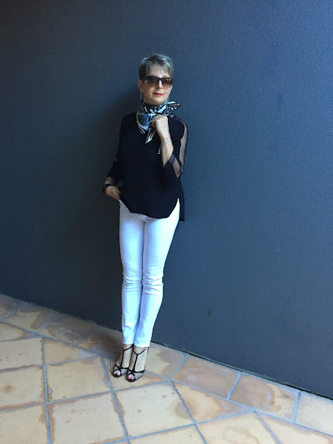 white denims, black blouse, stiletto shoes, vintage scarf