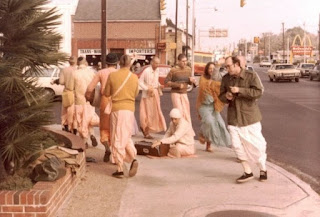 Street Sankirtan in Gainesville (Sankarshan Das playing the harmonium.)