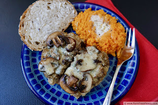 photo of blue plate with 2 slices bacon mushroom meatloaf and mashed sweet potatoes