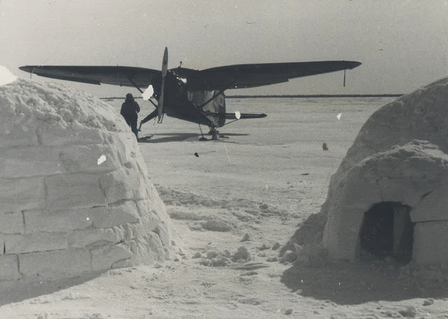 An airplane visit to an Eskimo village, 1938