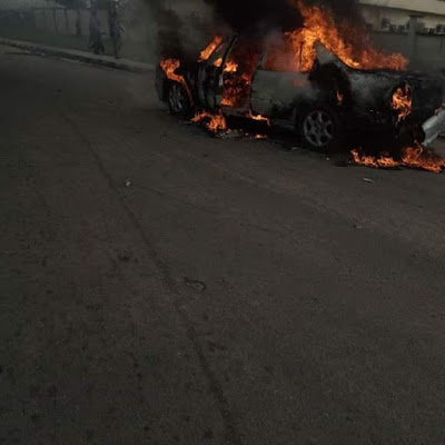 Photos: Young man drives car to Akwa Ibom House of Assembly complex, sets it on fire and flees