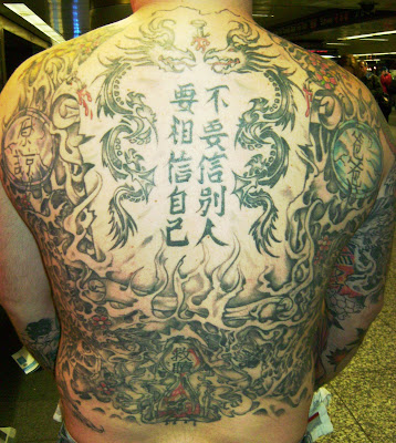 In fact he removed his shirt to reveal an incredible back piece