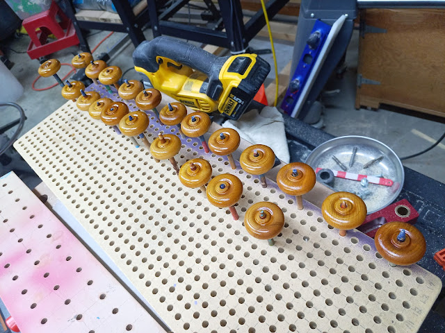 Wooden toy car wheels, hand-finished with amber shellac.