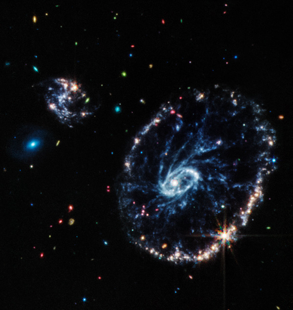 An image of the Cartwheel Galaxy that was taken by NASA's James Webb Space Telescope...using its Mid-Infrared Instrument.