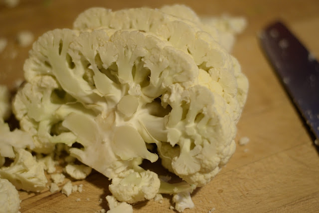 The head of cauliflower cut into steaks.