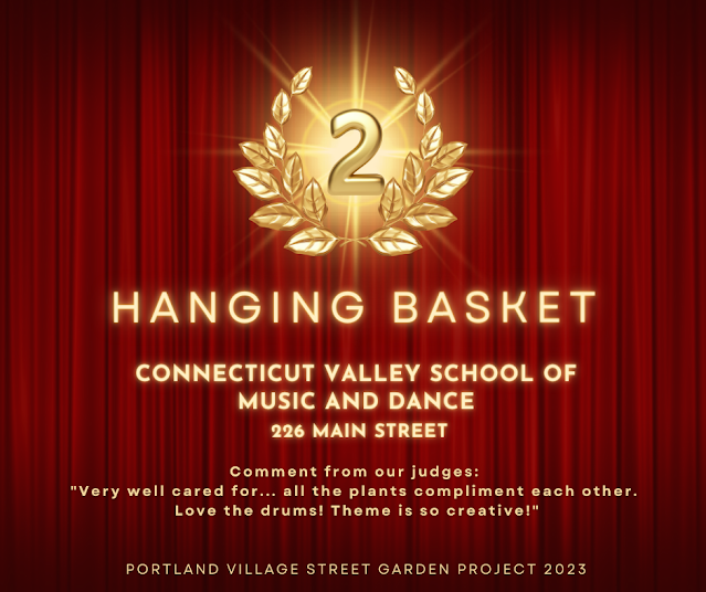 Second place - Hanging Baskets - Connecticut Valley School of Music and Dance -  226 Main Street.  Comment from our judges:  "Very well cared for... all the plants compliment each other.  Love the drums! Theme is so creative!"