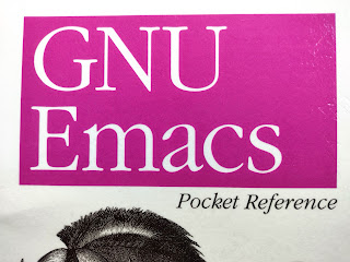 The top half of the front cover of the book GNU Emacs