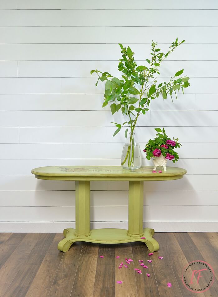 A long oval golden oak empire style console table makeover with French Country Charm with a gorgeous Chatellerault furniture transfer and green paint.