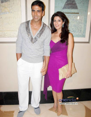 Akshay Kumar with his sexy wife Twinkle Khanna standing on party photo