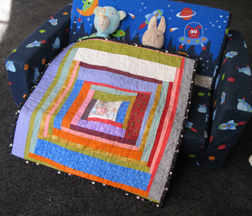 Log Cabin style Doll Quilt made entirely with scraps of fabric ~ Threading My Way