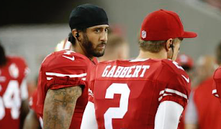 Colin Kaepernick Will Continue To Sit Through National Anthem Until There's 'Change'