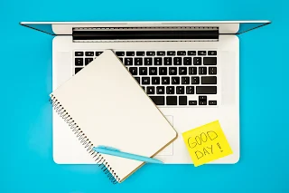 notebook notepad and paper reminder with text good day flat lay
