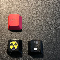 The two wasd keycaps (left) and an OEM keycap from a GMMK keyboard for comparison