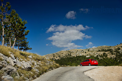 Red car in the middle of nowhere