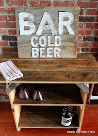 rustic farmhouse table and vintage bar sign