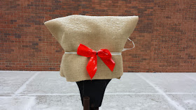 simple burlap, tied with a red bow
