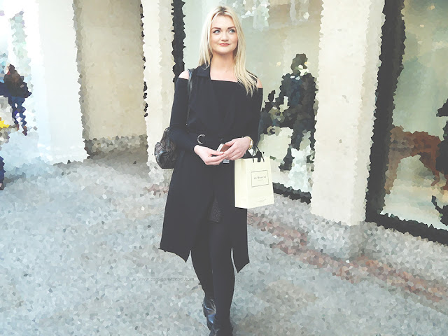 Blonde girl in an all black outfit