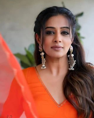 Priyamani smiling and laughing while wearing a casual outfit