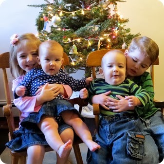 All Four Kids by Christmas Tree