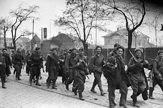 Russian troops walk through the roads of Vienna not long after the battling for the city was finished 