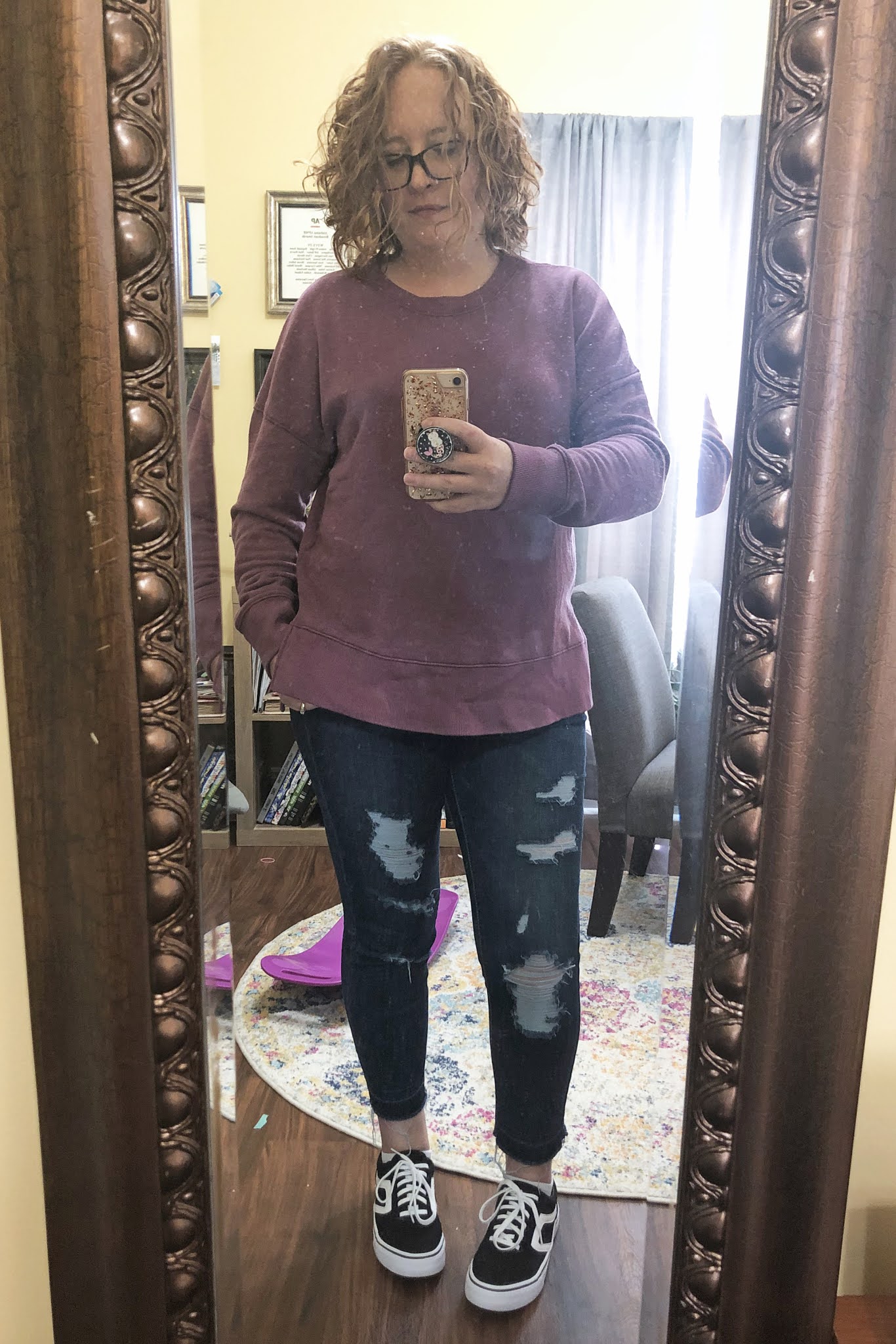 purple sweatshirt ripped jeans