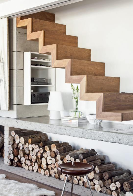 Wooden staircase above the fireplace 