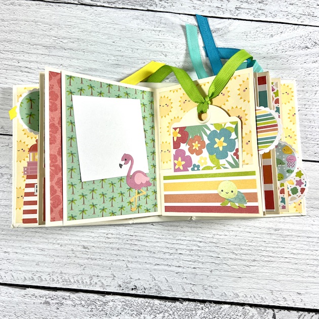 summer scrapbook mini album with palm tress and flamingo