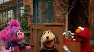 Elmo, Abby, and Mick perform a musical goodbye. Sesame Street Episode 5005, A Dog and a Song, Season 50.