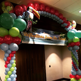  Tropical teemed balloon arch 