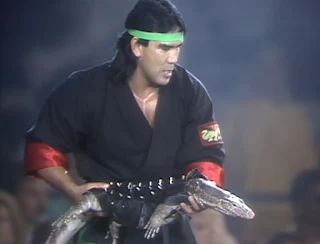 WCW / NWA Great American Bash 1989 - Ricky Steamboat carried a dragon to the ring minutes after Jim Ross called pet gimmicks stupid