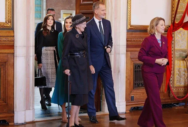 Queen Letizia wore a green midi dress by Dandara, and Carolina herrera coat. Princess Mary wore a Red Valentino top