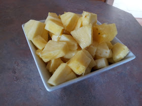A bowl of freshly cut pineapple