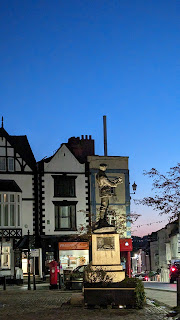 Statue of Charles Rolls from the side at dusk with a glorious dark blue sky, Monmouth