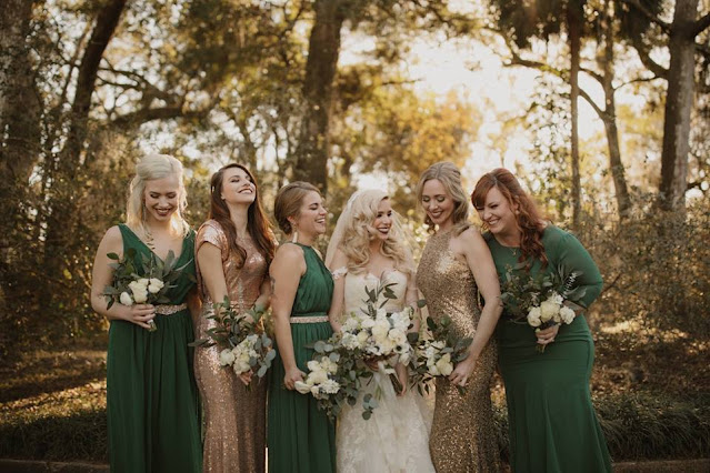 bridesmaids with green dresses and gold glitter dresses