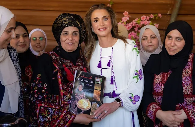 Queen Rania wore a floral embroidered midi dress by Giambattista Valli. Andrew Gn embellished dress