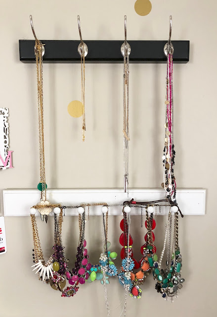 Organized Necklaces hanging on coat hooks