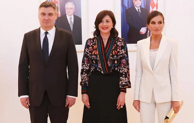 Queen Letizia wore a slim-fit tuxedo-style jacket by Hugo Boss. First Lady Sanja Music Milanovic wore a kimono floral print blouse