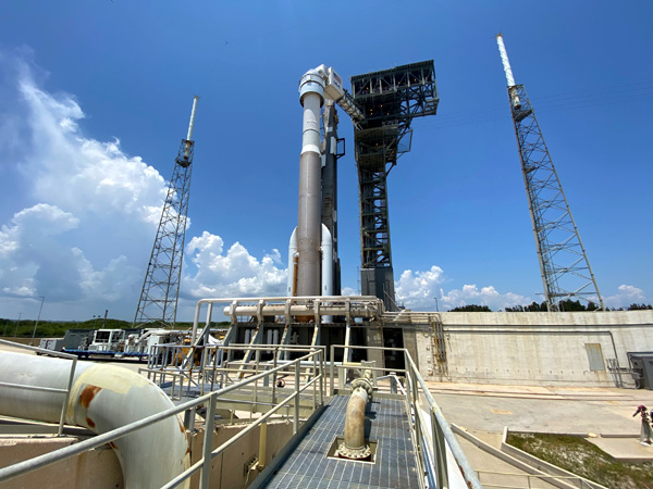 The Crew Access Tower's swing arm is extended to the Starliner capsule at Cape Canaveral Space Force Station's SLC-41 launch pad in Florida...on May 18, 2022.