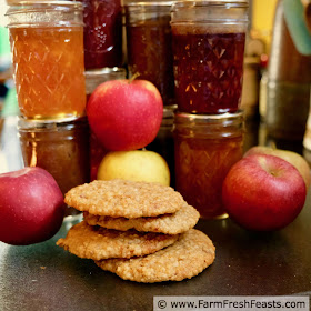 pic of apple butter muffin top cookies with jars of jam and apple butter